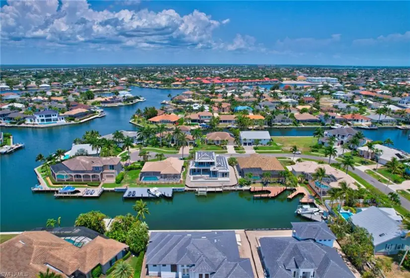 Birds eye view of property with a water view