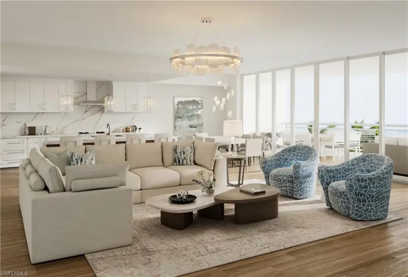 Living room with light hardwood / wood-style floors, sink, a chandelier, and a wall of windows