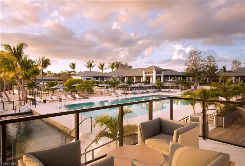 Pool at dusk featuring outdoor lounge area and a patio