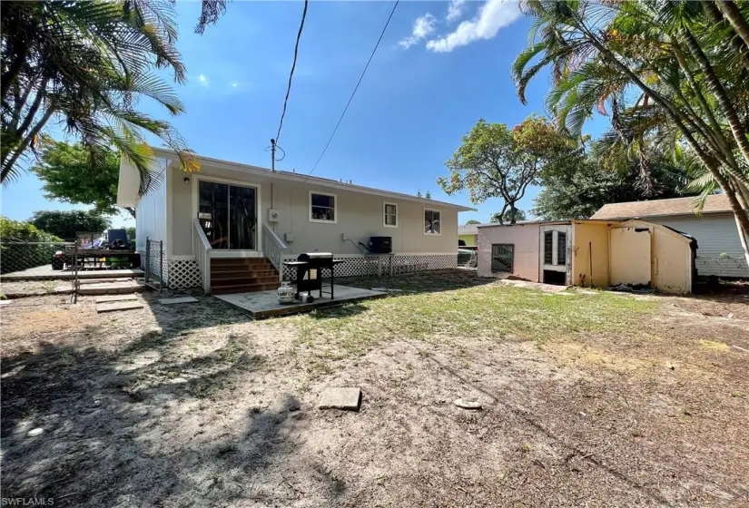 Back of house with a patio area