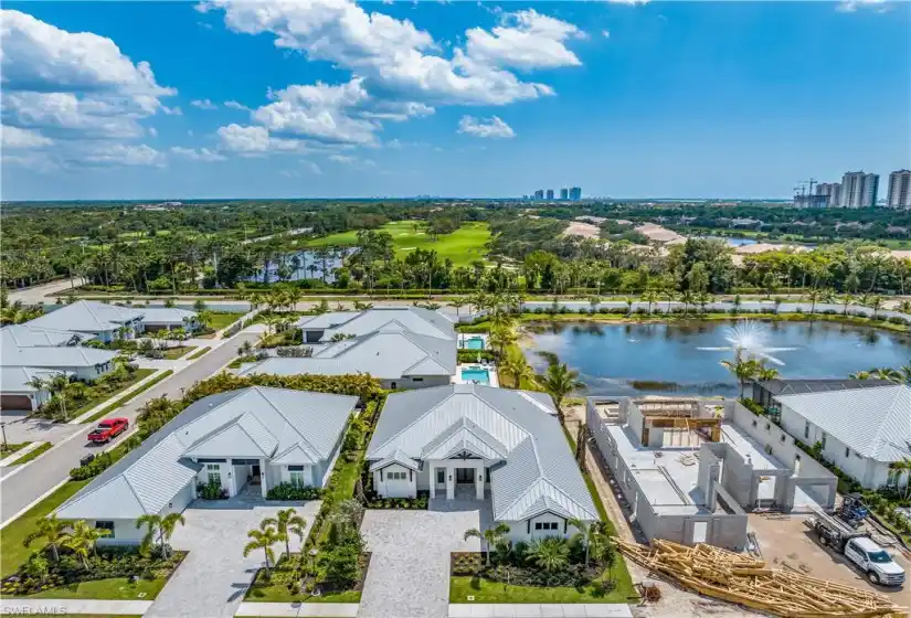 4523 is the home shown in the middle, with southern exposure from the pool and a peek of the community lake and water feature.